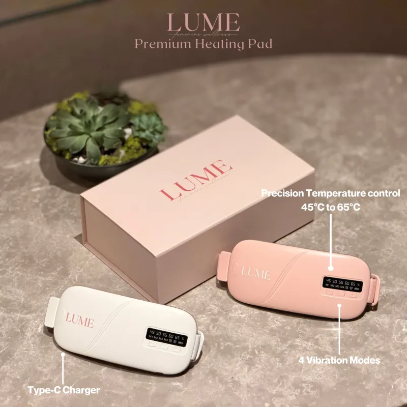 LUME Premium Heating Pad in blush pink and ivory, beside its gift box